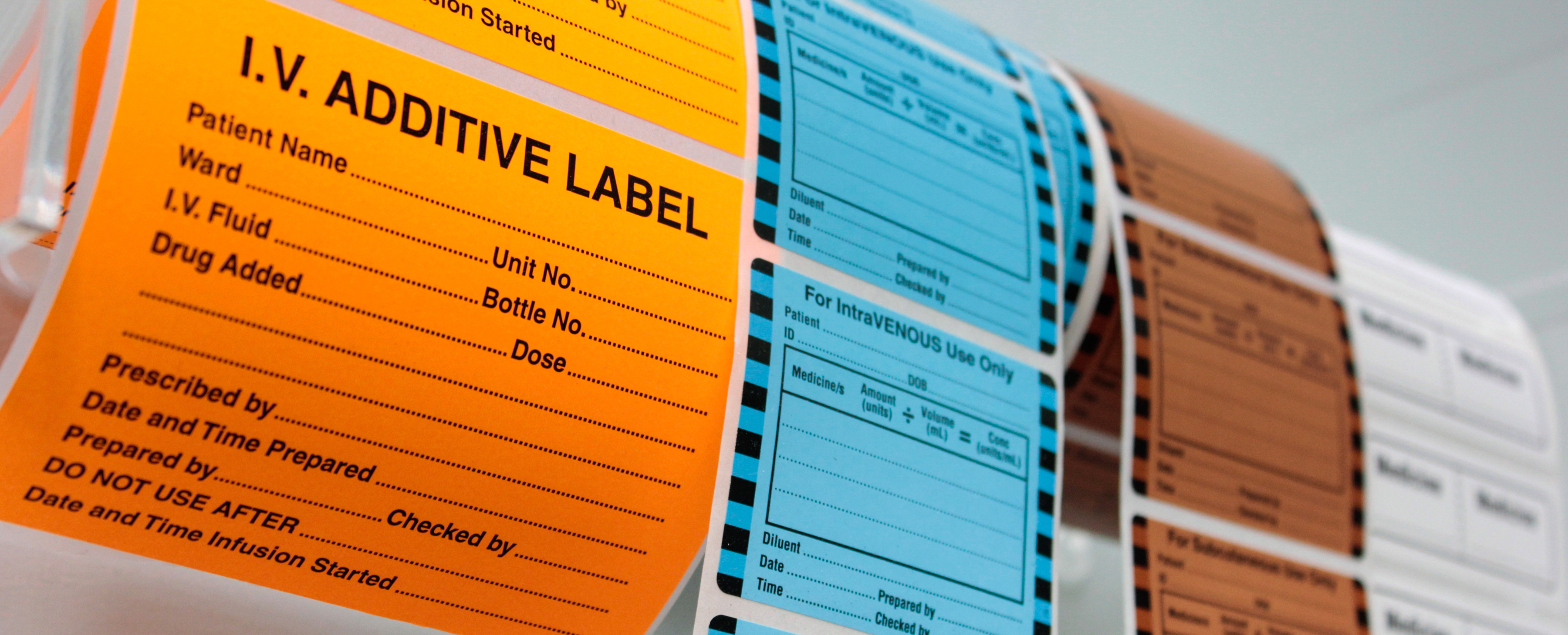 IV-banner-Rolls-of-medicine-labels