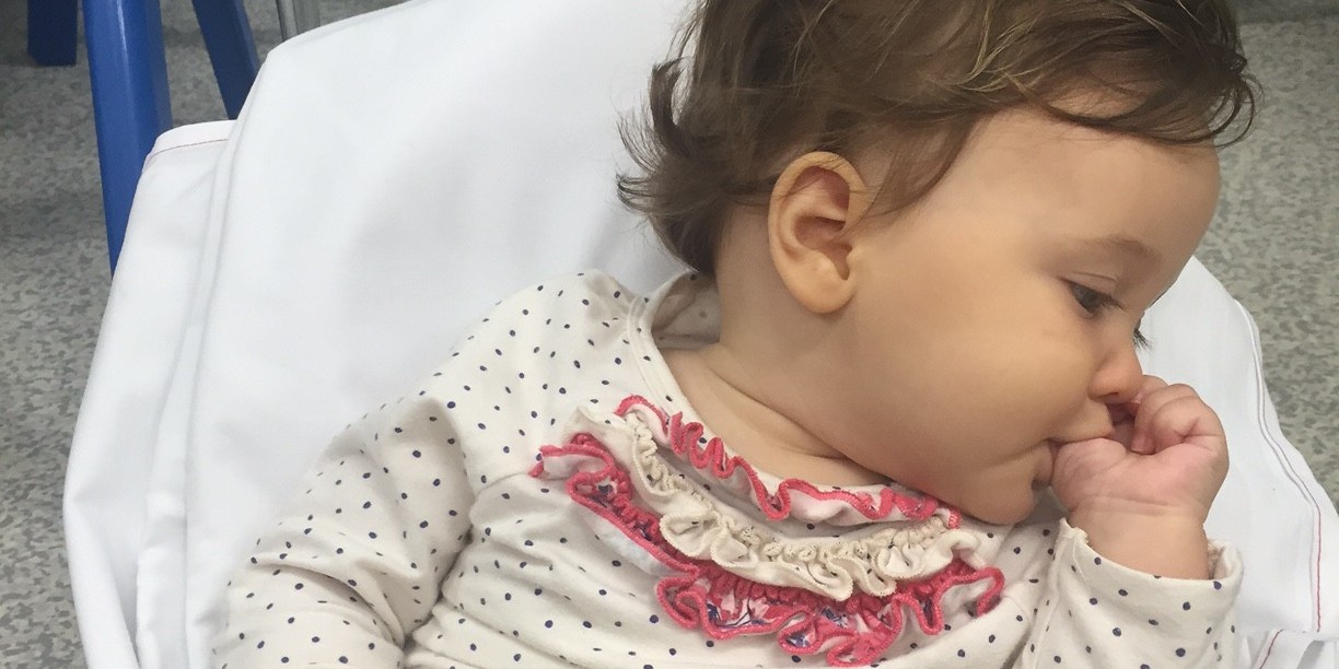 This 6 month old baby indicated she was overstimulated by turning her head away from the therapist and calming herself through thumb sucking.  After a brief 'time out' she turned back to midline, removed her thumb and re-engaged. 'tuning out' and looking away allowed the baby to regulate her own state.