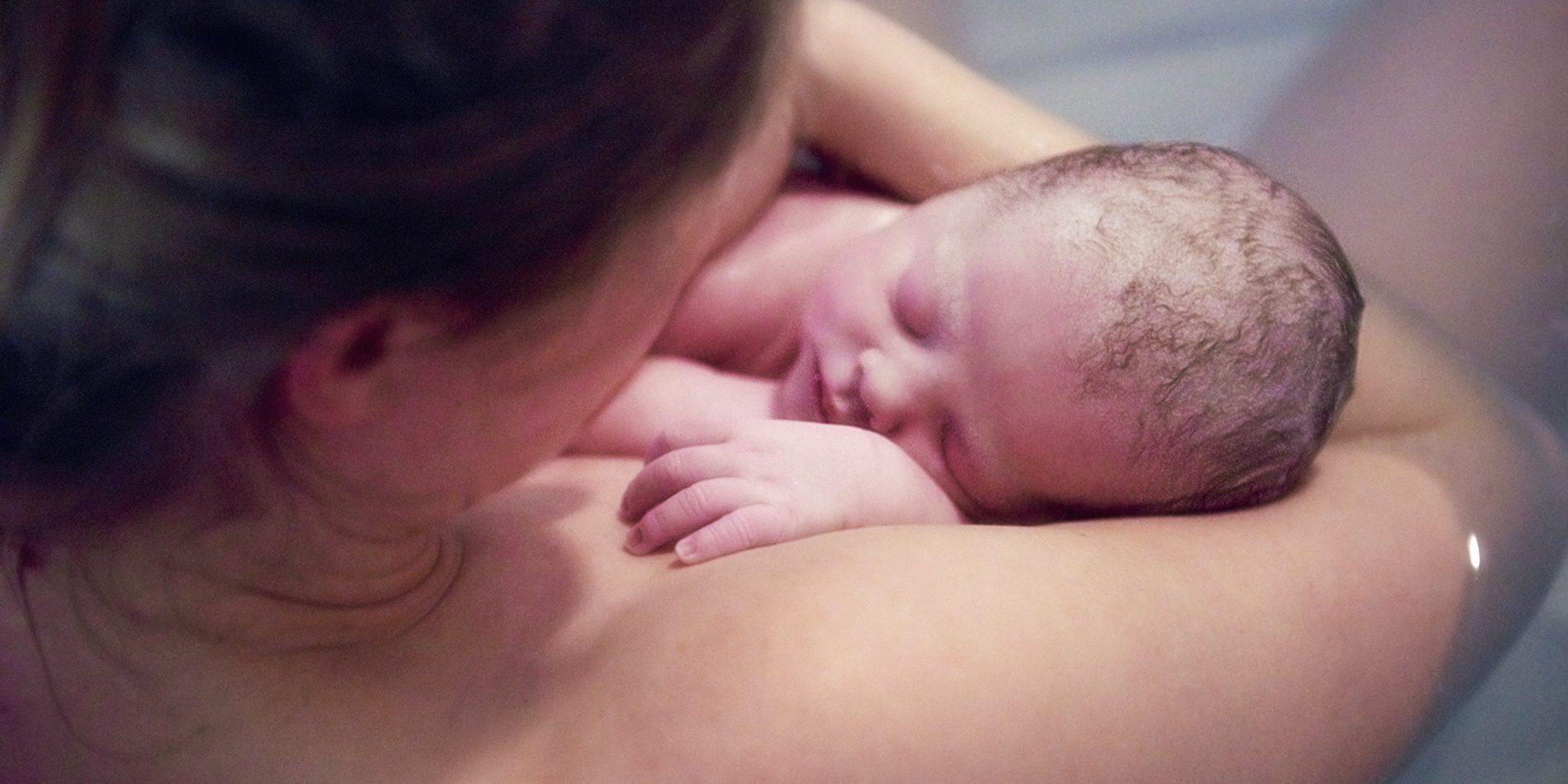 over-shoulder-portrait-of-young-woman-holding-new-2022-03-04-01-52-00-utc